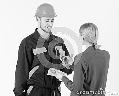 Customer give money to repairman, builder, mechanic with toolbox. Repairer happy get salary for work. Payday and payment Stock Photo