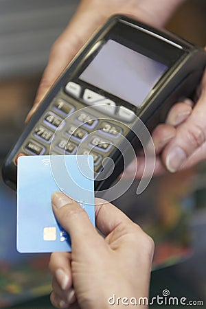 Customer Making Purchase Using Contactless Payment Stock Photo