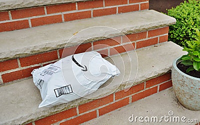 Customer Order Package Delivered to Home on Door Step Editorial Stock Photo