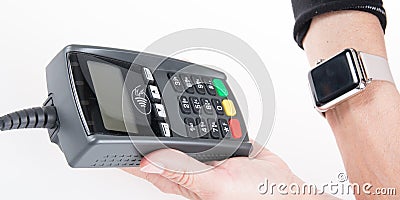 Customer paying bill by watch phone contactless Editorial Stock Photo