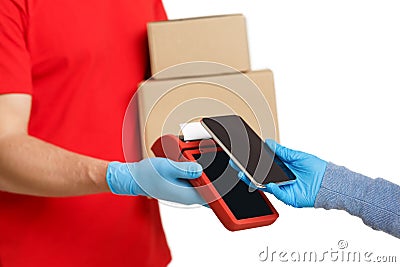 Customer pays for delivery using smartphone on contactless terminal Stock Photo