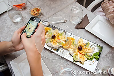 Customer photographing food Stock Photo