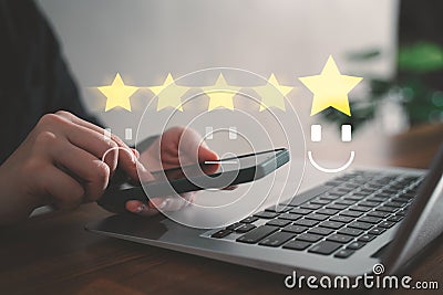 Customer rate their satisfaction ranking for experience review survey with smart phone and laptop Stock Photo