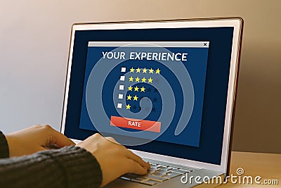 Customer review concept on laptop computer screen on wooden table Stock Photo