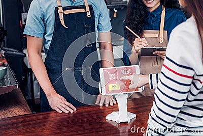 Customer self service order drink menu with tablet screen at cafe counter bar,seller coffee shop accept payment by mobile.digital Stock Photo