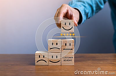 customer services best excellent business rating experience. Satisfaction survey concept. Hand of a businessman chooses a smile Stock Photo