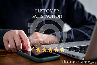Customer rate their satisfaction ranking for experience review survey with smart phone and laptop Stock Photo