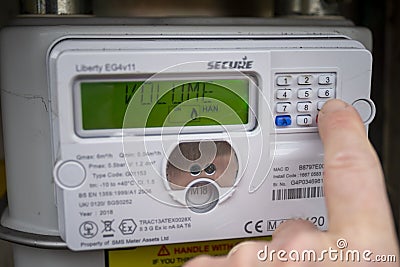 Gas meter being checked, UK. Volume message Editorial Stock Photo