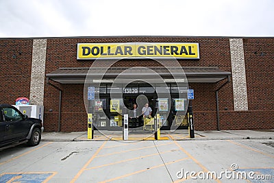 Customers exiting Dollar General with carts full of items Editorial Stock Photo