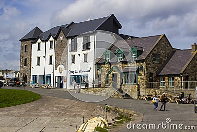 Customers outside a pub in Mullaghmore Ireland Editorial Stock Photo