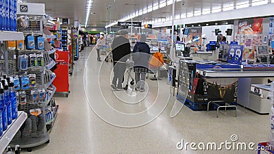 Customers queueing at the checkouts in a supermarket or superstore. Editorial Stock Photo