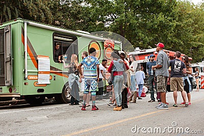 Customers Stand In Line To Buy Meals From Food Trucks Editorial Stock Photo
