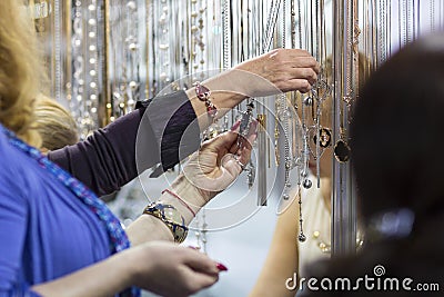 Customers in the store choosing jewelry items Stock Photo