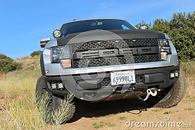 A customized Ford F-150 Raptor SVT on a dirt road Editorial Stock Photo