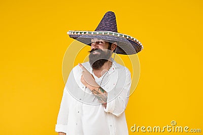 Customs and culture. Guy cheerful festive mood at party. Man in mexican hat. Explore heritage on your paternal line Stock Photo