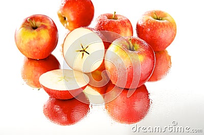 Cut apple in wet group, mirror Stock Photo