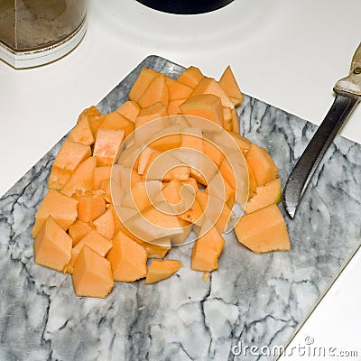 Cut cantaloupe on counter 6 Stock Photo