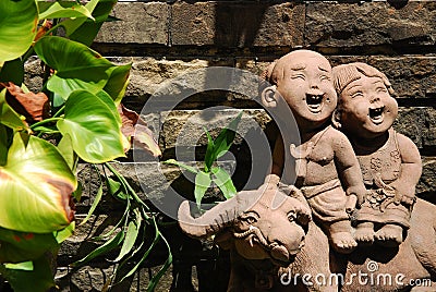 Cut child doll in garden Stock Photo
