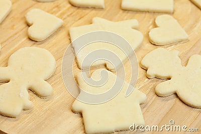 Cut in the dough snowman, heart, and house Stock Photo