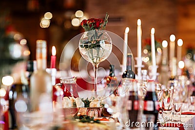 Cut flowers arrangement in round clear glass vase Stock Photo
