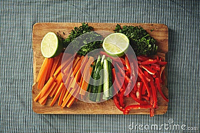 Cut fresh vegetables on a wooden board Stock Photo