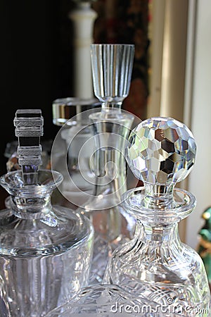 Cut glass decanters in window Stock Photo