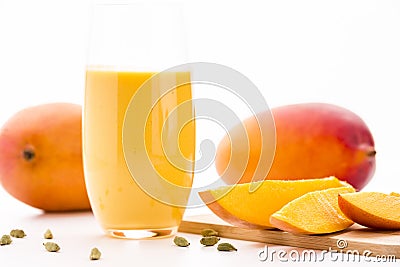 Cut Mango Pieces, Cardamon And Fruit Shake Stock Photo