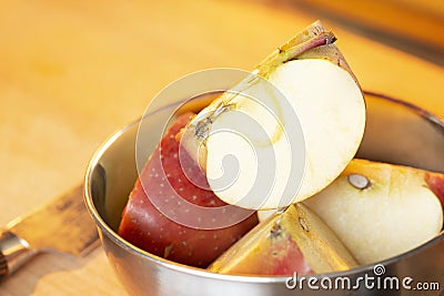 Cut open apple in bowl Stock Photo