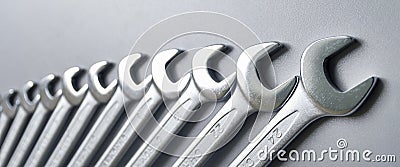 Cut-out wrenches horizontally placed from the biggest to the smallest in a row. Top view composition. Hand tool. Tools Stock Photo