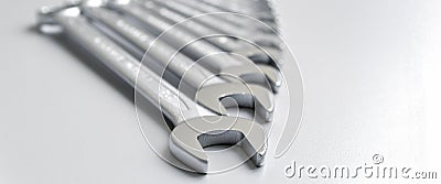 Cut-out wrenches horizontally placed from the biggest to the smallest in a row. Top view composition. Hand tool. Tools Stock Photo