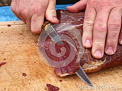 Cut roasted meat beef by a chef Stock Photo