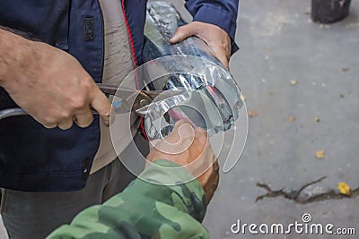 Cut Roof Gutter Downspout with Tin Snips 2 Stock Photo