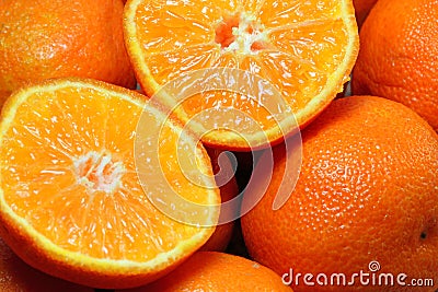 Cut or sliced oranges as a background. Stock Photo