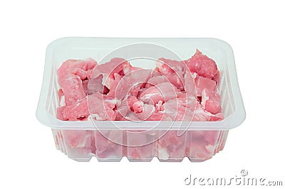 Cut into small pieces of raw pork meat in plastic packaging. Stock Photo