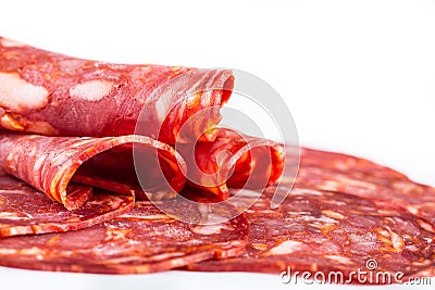 Cut Spanish sausage or salami chorizo. Isolated on white Stock Photo