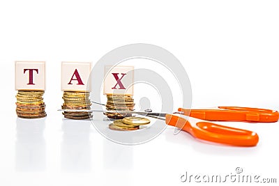 Cut taxes concept with coins and scissors Stock Photo