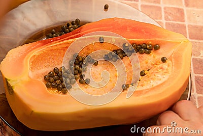 Cut into two parts papaya fruit with seeds Stock Photo