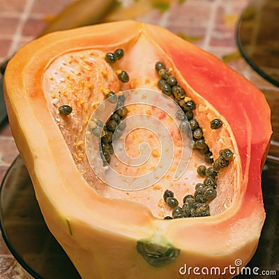 Cut into two parts papaya fruit with seeds Stock Photo