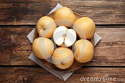 Cut and whole apple pears on wooden table, top view Stock Photo
