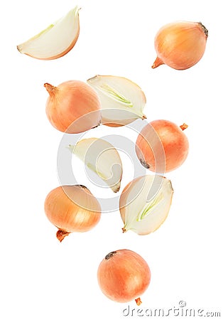 Cut and whole onion bulbs falling on background Stock Photo