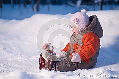 Cute adorable baby sit on snow Stock Photo