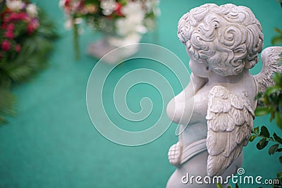 Cute Angel statue in the garden. Beautiful, thais, cupid Stock Photo