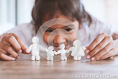 Asian child girl playing with plasticine clay happy family with fun. Happy family concept Stock Photo