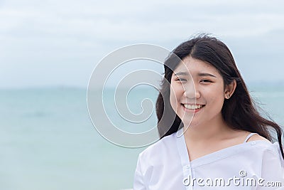 Cute asian fat teen portrait toothy smile happy holiday Stock Photo