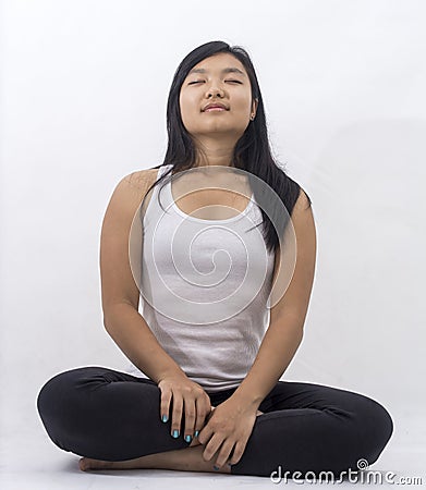 Cute asian girl on isolated background on meditation Stock Photo