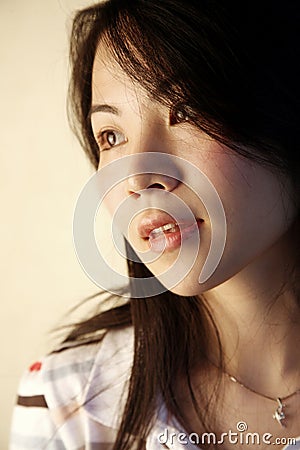 Cute Asian girl looking to the side Stock Photo
