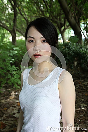 Cute Asian girl looking at the viewer Stock Photo