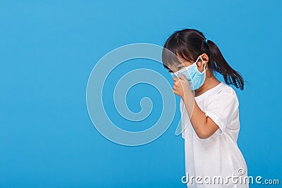 Cute Asian girl wearing mask to prevent the virus PM2.5, Coronavirus, 2019-nCoV asian little girl feeling unwell and coughing as Stock Photo