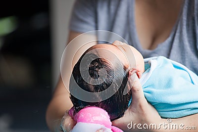 Cute asian newborn baby girl take a bath. Stock Photo