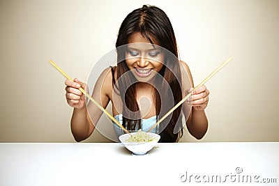 Cute Asian woman eating Stock Photo